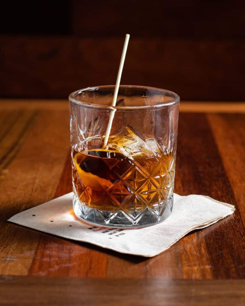 Bar Boss™ Bourbon, aromatic applewood salt, bitters, brandied cherries, orange