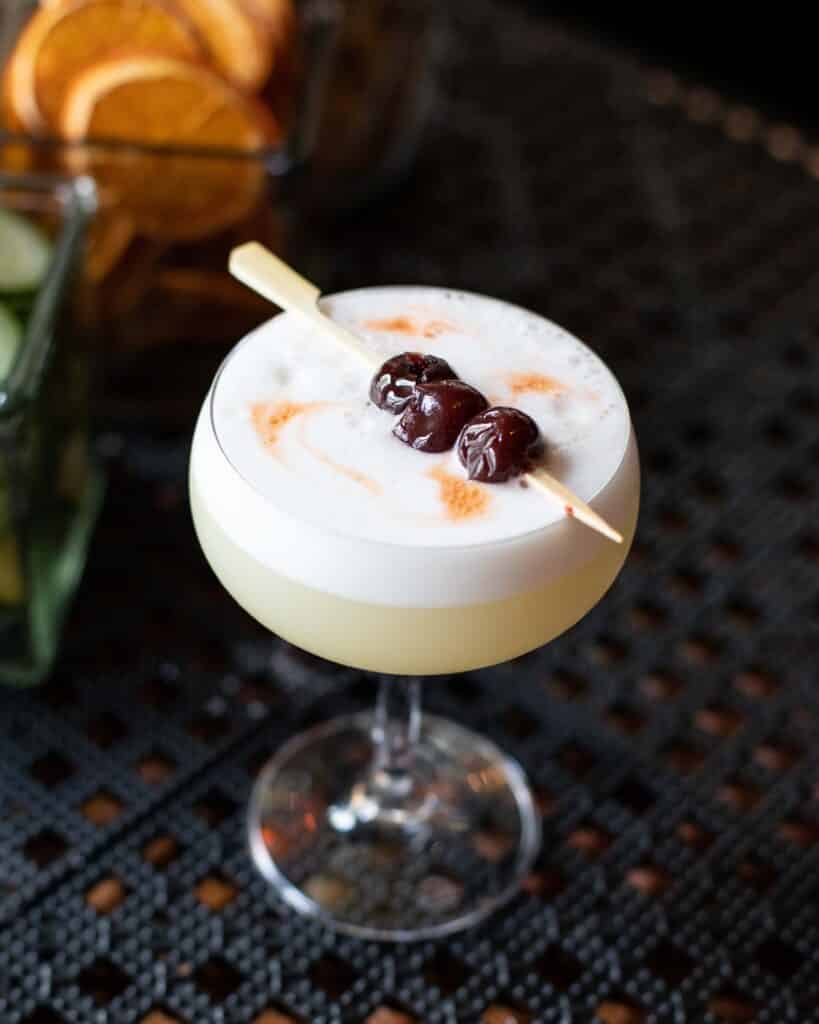 Bar Boss Gin™, egg white, citrus, orgeat, Angostura bitters